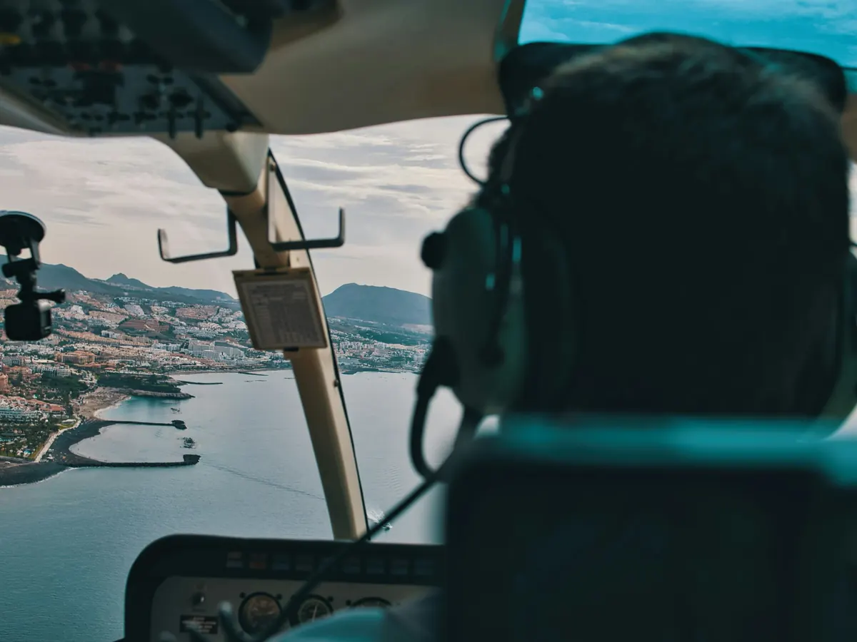 View from a helicopter cockpit over the coast